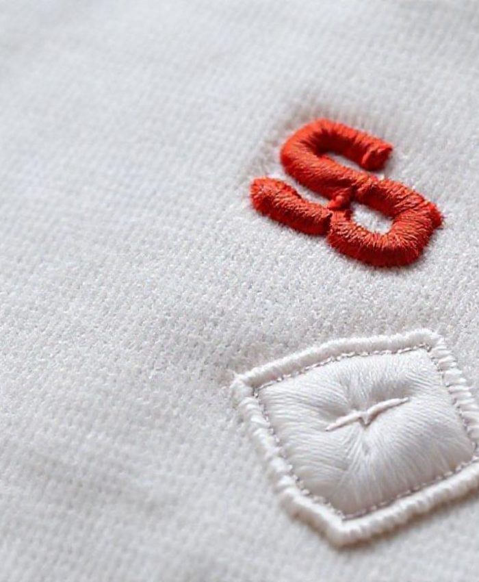 {"prompt":"Close-up view of a high-quality textile (e.g., thick cotton, soft fleece, or fine canvas) showcasing multiple computer embroidery techniques. The image should feature a prominent, slightly raised 3D puff logo in a bold color. Adjacent to it, a section of flat embroidery demonstrating fine detail and tight stitching. In another part, a subtle applique patch with a clean embroidered border. A hint of metallic thread or specialty thread could be subtly incorporated. The overall mood should be premium, precise, and sophisticated, highlighting the texture and craftsmanship. Soft, diffused lighting, shallow depth of field to emphasize the embroidered details.","originalPrompt":"Close-up view of a high-quality textile (e.g., thick cotton, soft fleece, or fine canvas) showcasing multiple computer embroidery techniques. The image should feature a prominent, slightly raised 3D puff logo in a bold color. Adjacent to it, a section of flat embroidery demonstrating fine detail and tight stitching. In another part, a subtle applique patch with a clean embroidered border. A hint of metallic thread or specialty thread could be subtly incorporated. The overall mood should be premium, precise, and sophisticated, highlighting the texture and craftsmanship. Soft, diffused lighting, shallow depth of field to emphasize the embroidered details.","width":768,"height":768,"seed":42,"model":"flux","enhance":false,"nologo":false,"negative_prompt":"undefined","nofeed":false,"safe":false,"quality":"medium","image":[],"transparent":false,"has_nsfw_concept":false,"concept":{"special_scores":{"0":0.4359999895095825,"1":-0.04899999871850014,"2":-0.0729999989271164},"special_care":[[0,0.4359999895095825]],"concept_scores":{"0":-0.04500000178813934,"1":-0.07900000363588333,"2":-0.04100000113248825,"3":-0.05700000002980232,"4":-0.07500000298023224,"5":-0.05400000140070915,"6":-0.06300000101327896,"7":-0.052000001072883606,"8":-0.03799999877810478,"9":-0.09600000083446503,"10":-0.05299999937415123,"11":-0.04800000041723251,"12":-0.05299999937415123,"13":-0.05700000002980232,"14":-0.07999999821186066,"15":-0.07699999958276749,"16":-0.04699999839067459},"bad_concepts":[]},"trackingData":{"actualModel":"flux","usage":{"completionImageTokens":1,"totalTokenCount":1}}}